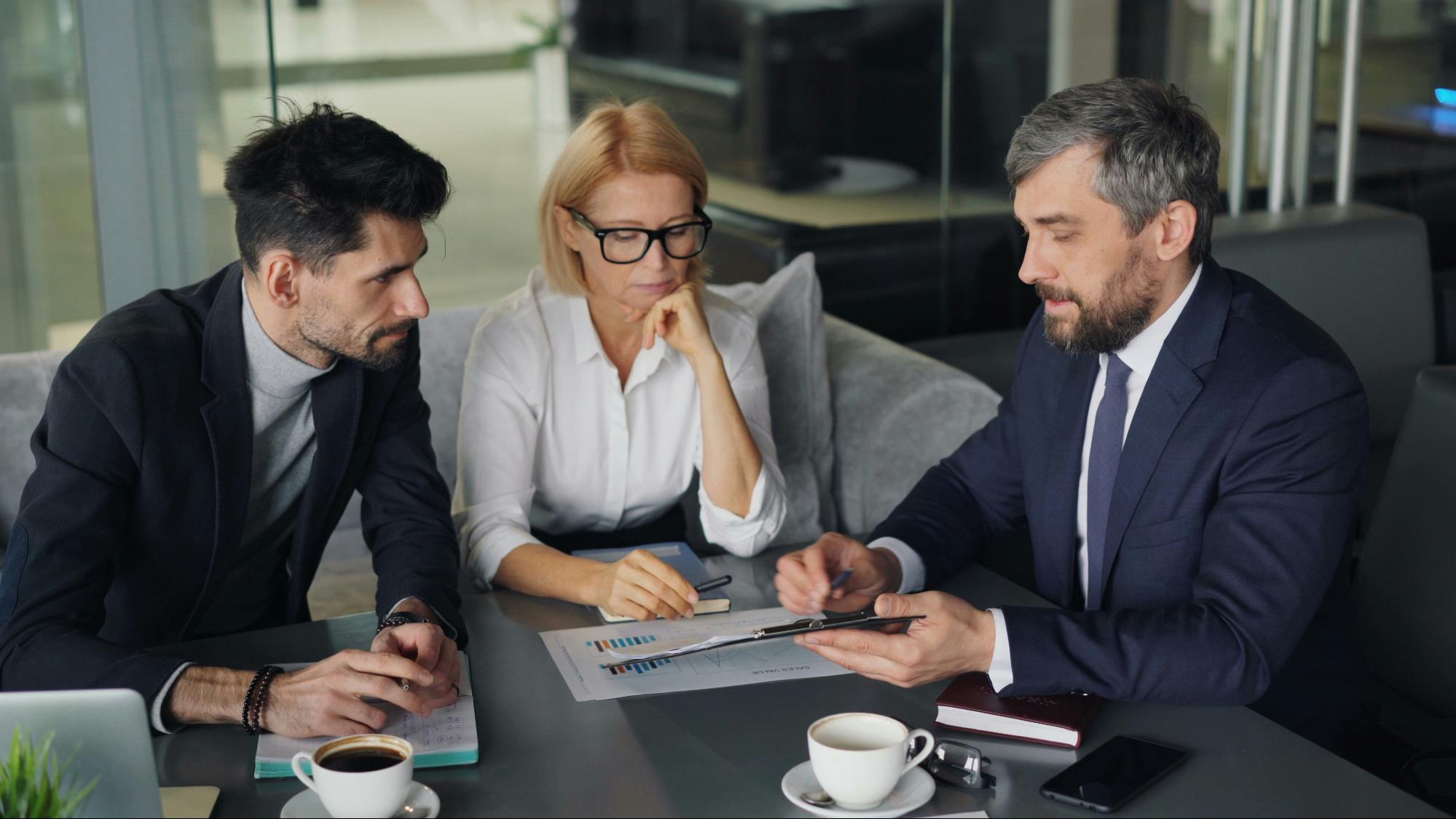Business professionals discussing compliance and risk
