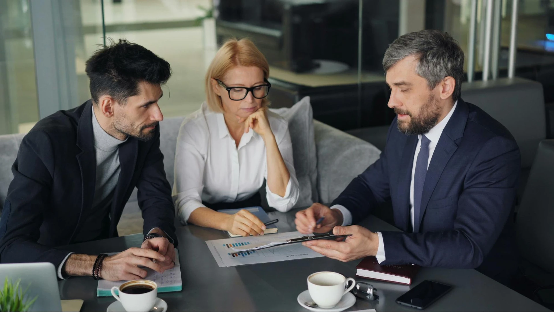 Business professionals discussing compliance and risk